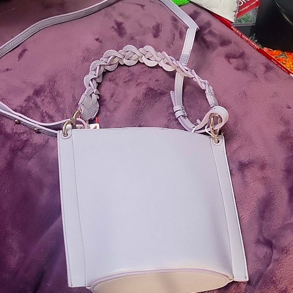 High end purse never used comes with a dust bag
